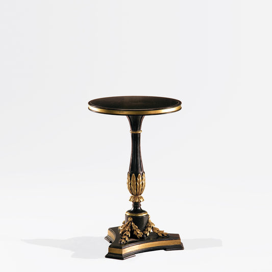 Ornate black and gold accent table.
