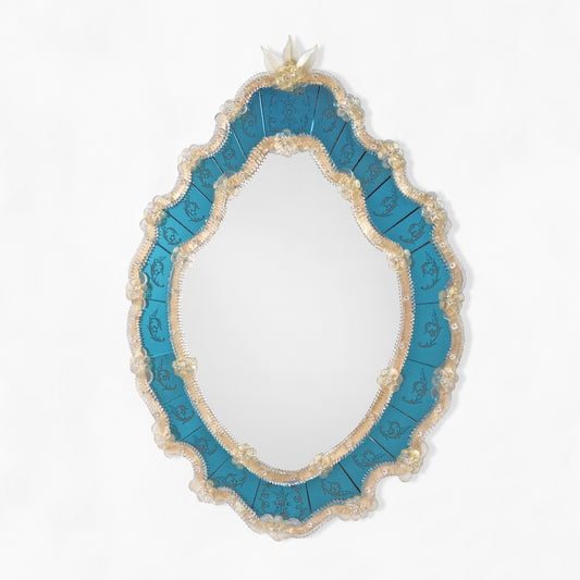 Blue Murano glass mirror with gold border.