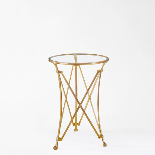 Brass gueridon table with glass top.