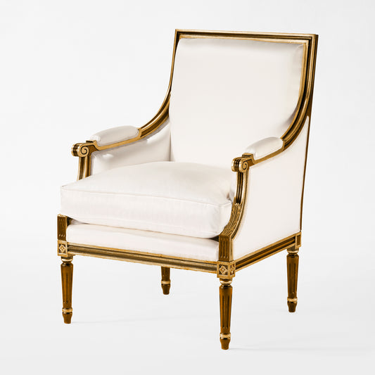 Brown and gold armchair with white fabric.