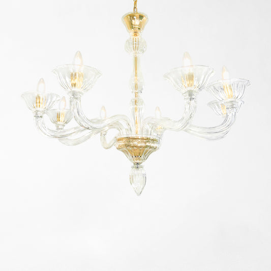 Clear Murano glass chandelier with gold hardware.