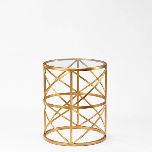 Round gold side table with glass top.