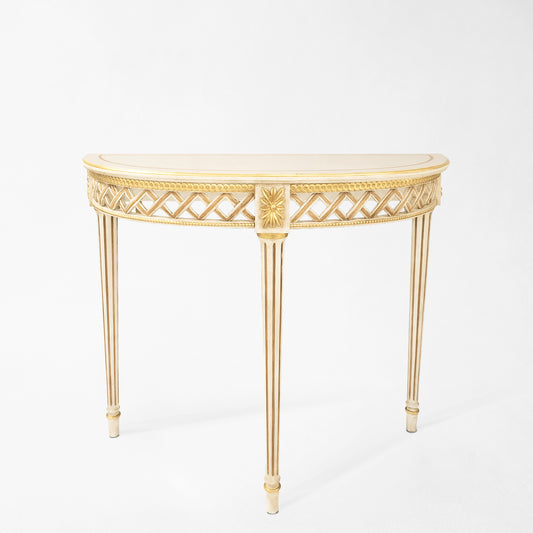White and gold console table.