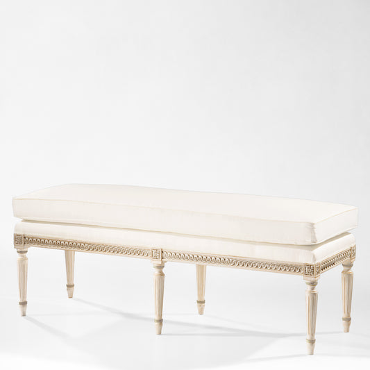 Antique white and silver bench with cream fabric.