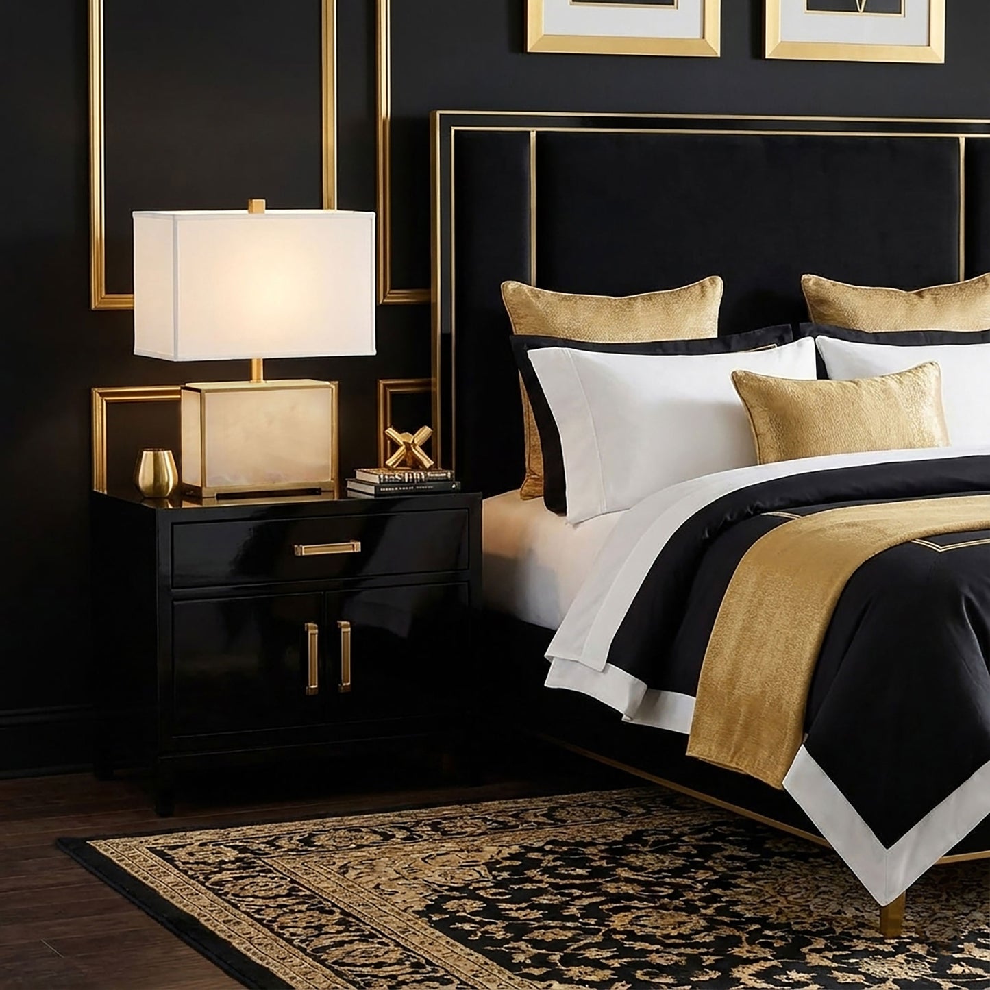 Luxurious bedroom with gold and black bedding, nightstand, and an antique brass and alabaster lamp.