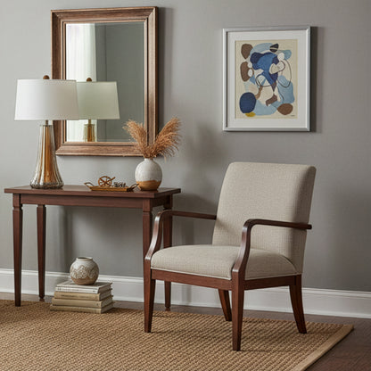 Living room corner with a chair, table, an amber Murano glass lamp, and wall art. 
