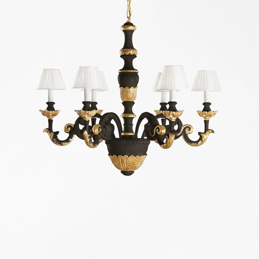 Traditional black and gold Italian chandelier and white pleated shades.