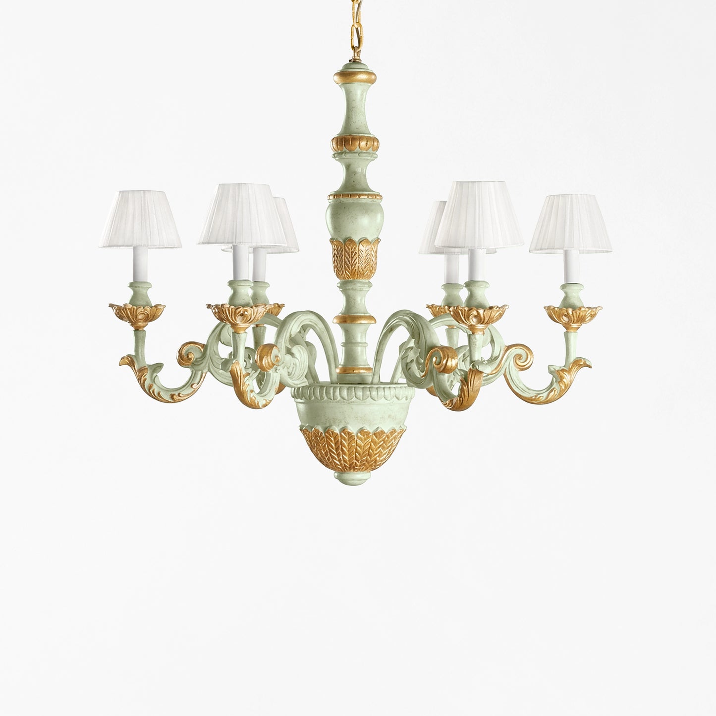 Traditional green and gold Italian chandelier and white pleated shades.