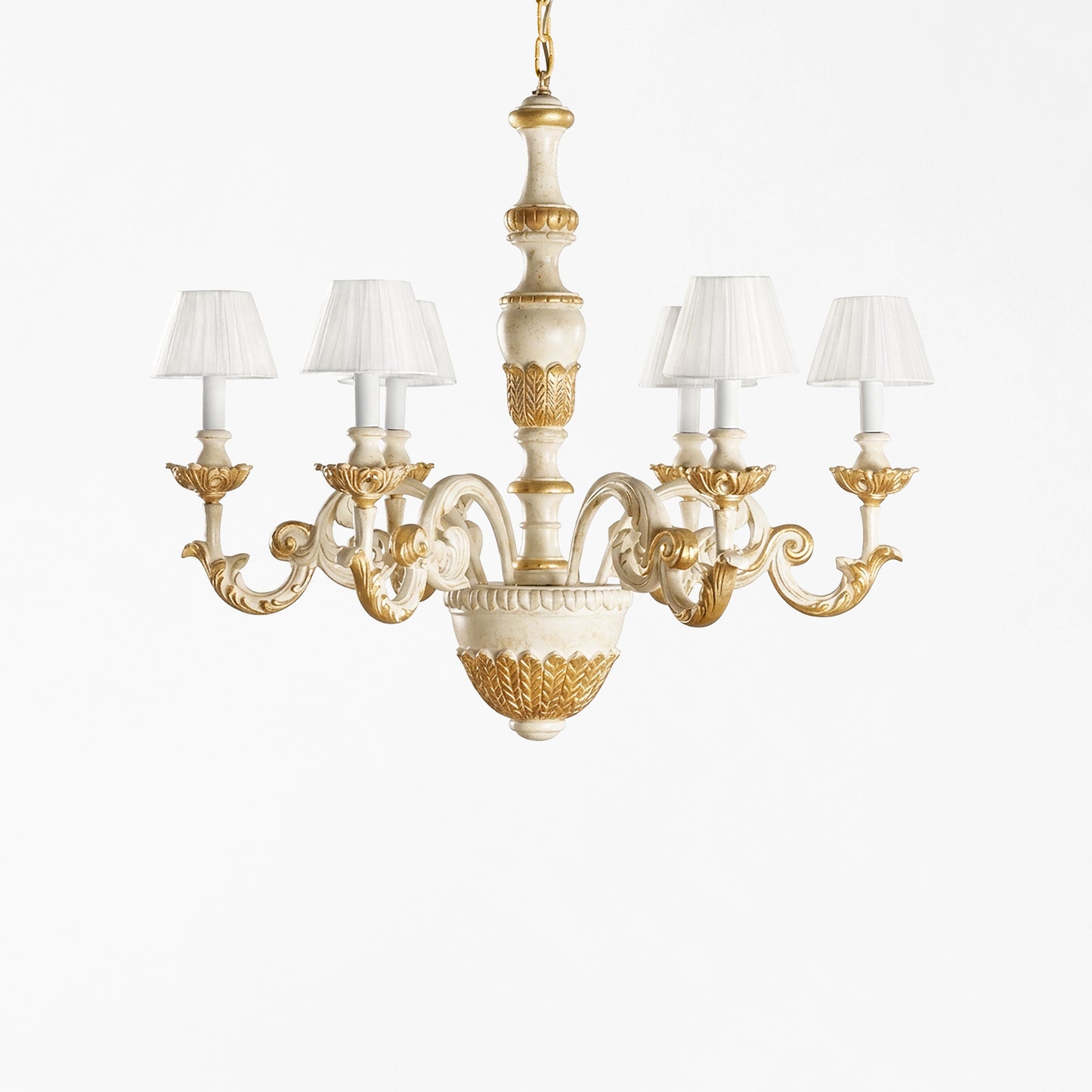 Traditional white and gold Italian chandelier and white pleated shades.