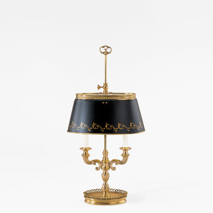 Antique brass bouillotte lamp with black shade.