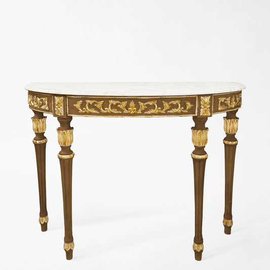 A traditional wood Italian console table with antique gold details and white marble top.