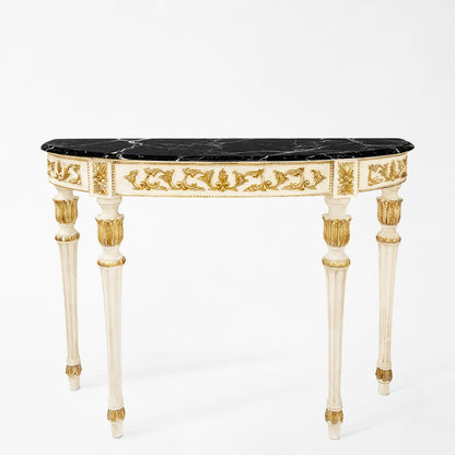 Ornate white and gold Italian console table with black marble top.