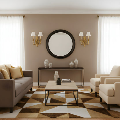 Living room with brown walls, a round mirror, and brass sconces.