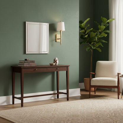 A brass sconce on a green wall in a living room.
