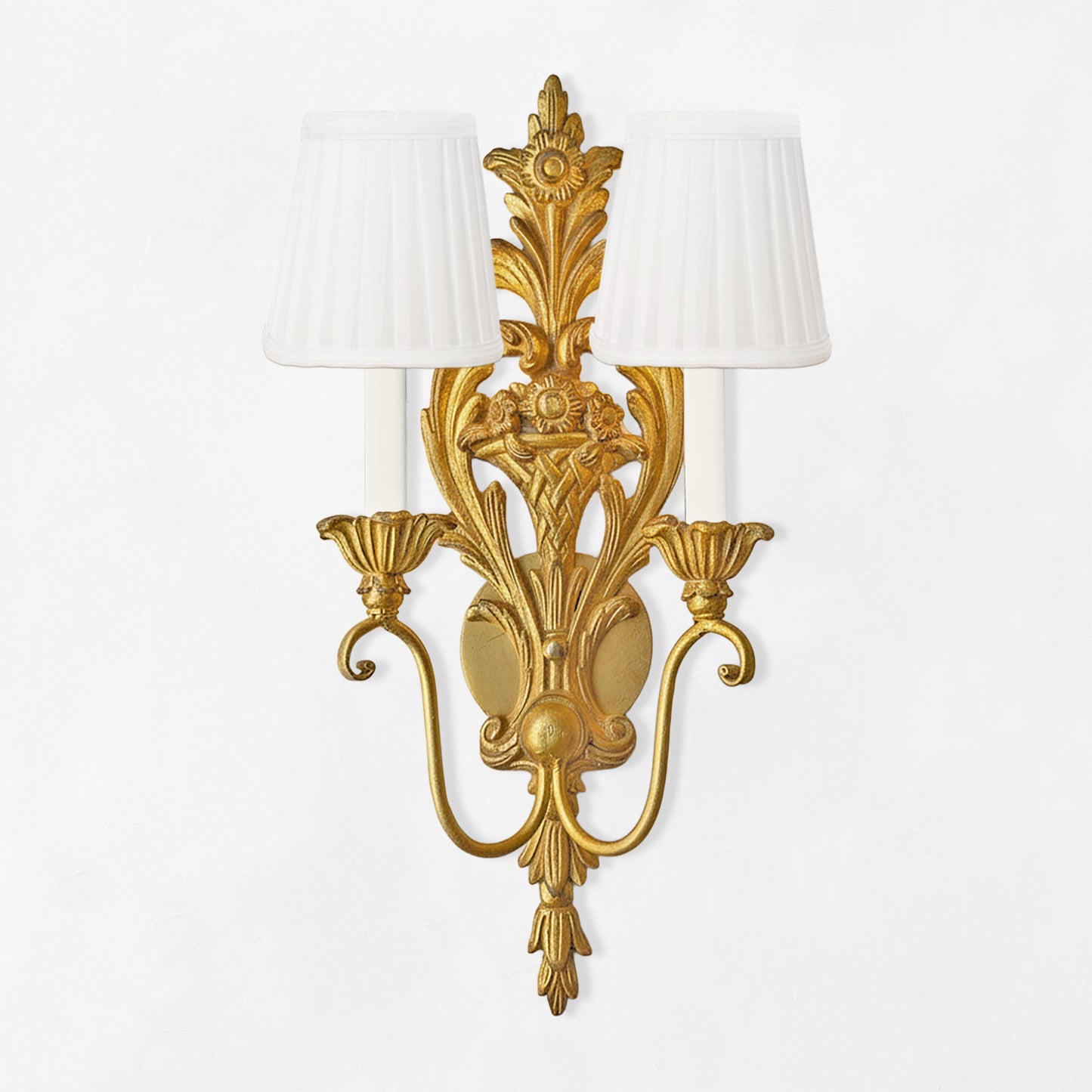 Traditional gold sconce with white pleated shades.