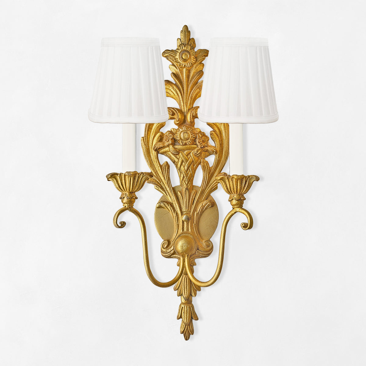 Luxurious gold sconce with white pleated shades.