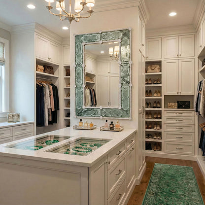 Antique green Murano glass mirror in luxurious walk-in closet with chandelier.