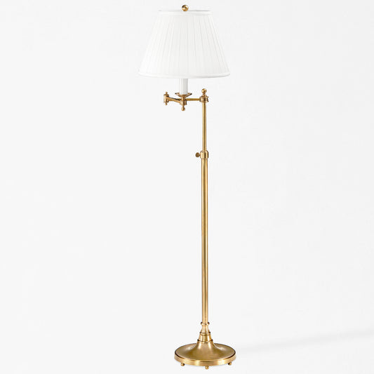 An antique brass floor lamp