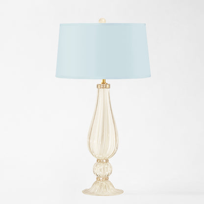 White Murano glass table lamp with light blue lamp shade.
