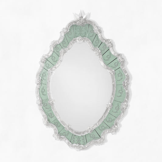 Ornate green Venetian glass mirror.
