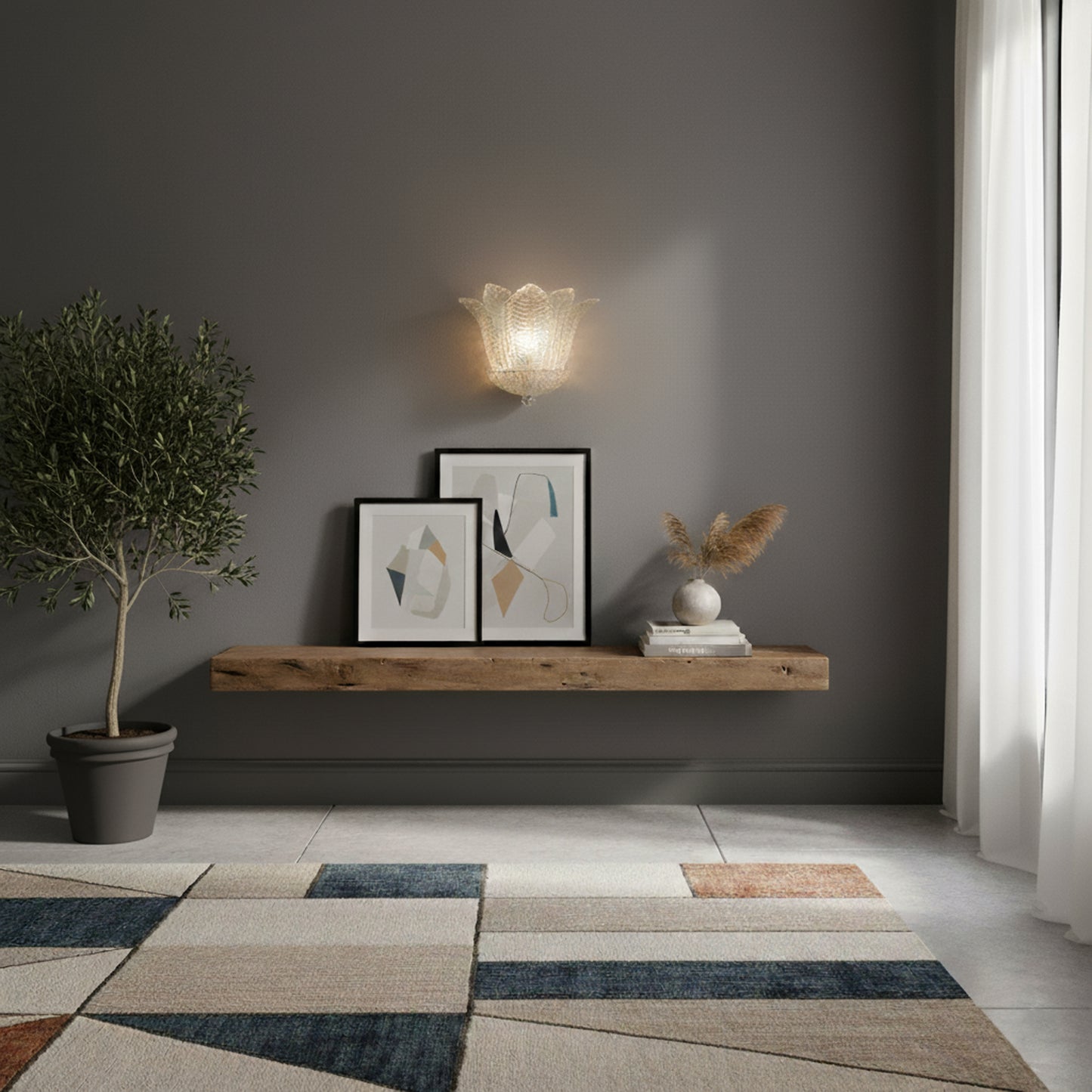 Handmade glass sconce on a grey wall in a transitionally designed room.