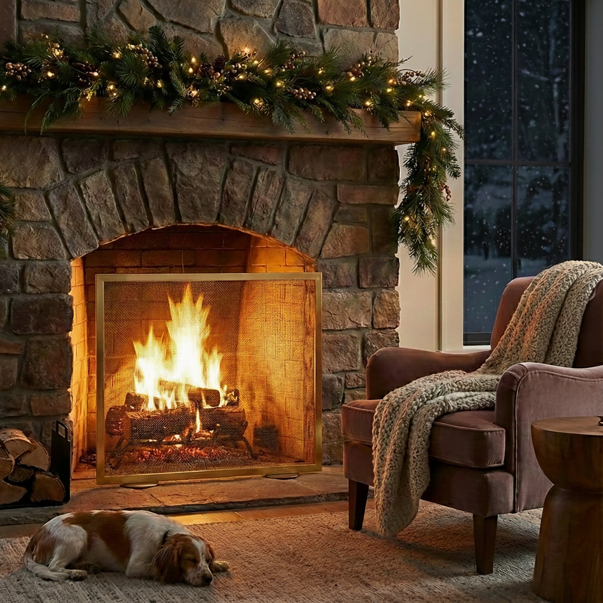A living room setting with a handmade brass fireplace screen.