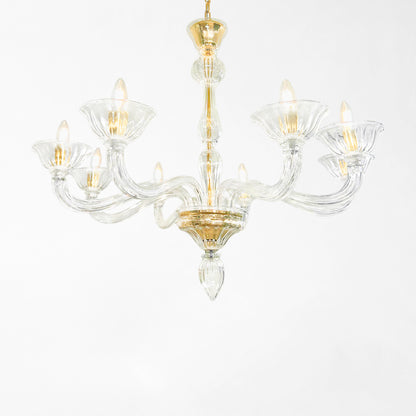 Clear Murano glass chandelier with gold hardware.