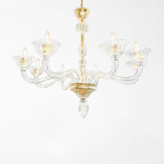 Clear Murano glass chandelier with gold hardware.