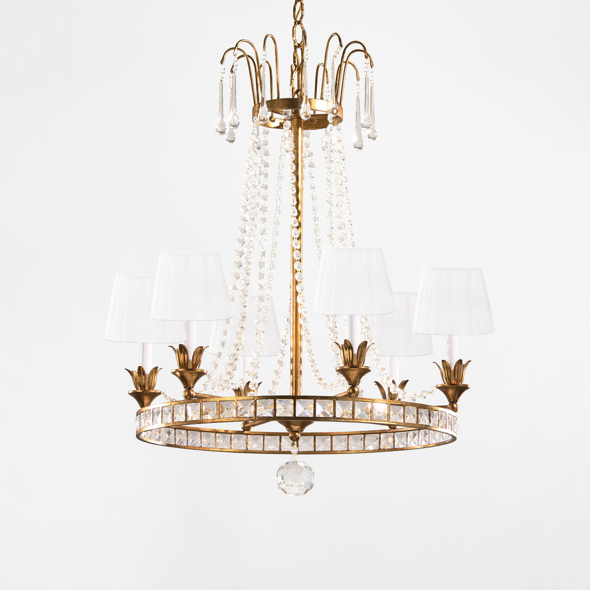 Antique gold Italian chandelier with crystals and white pleated shades.