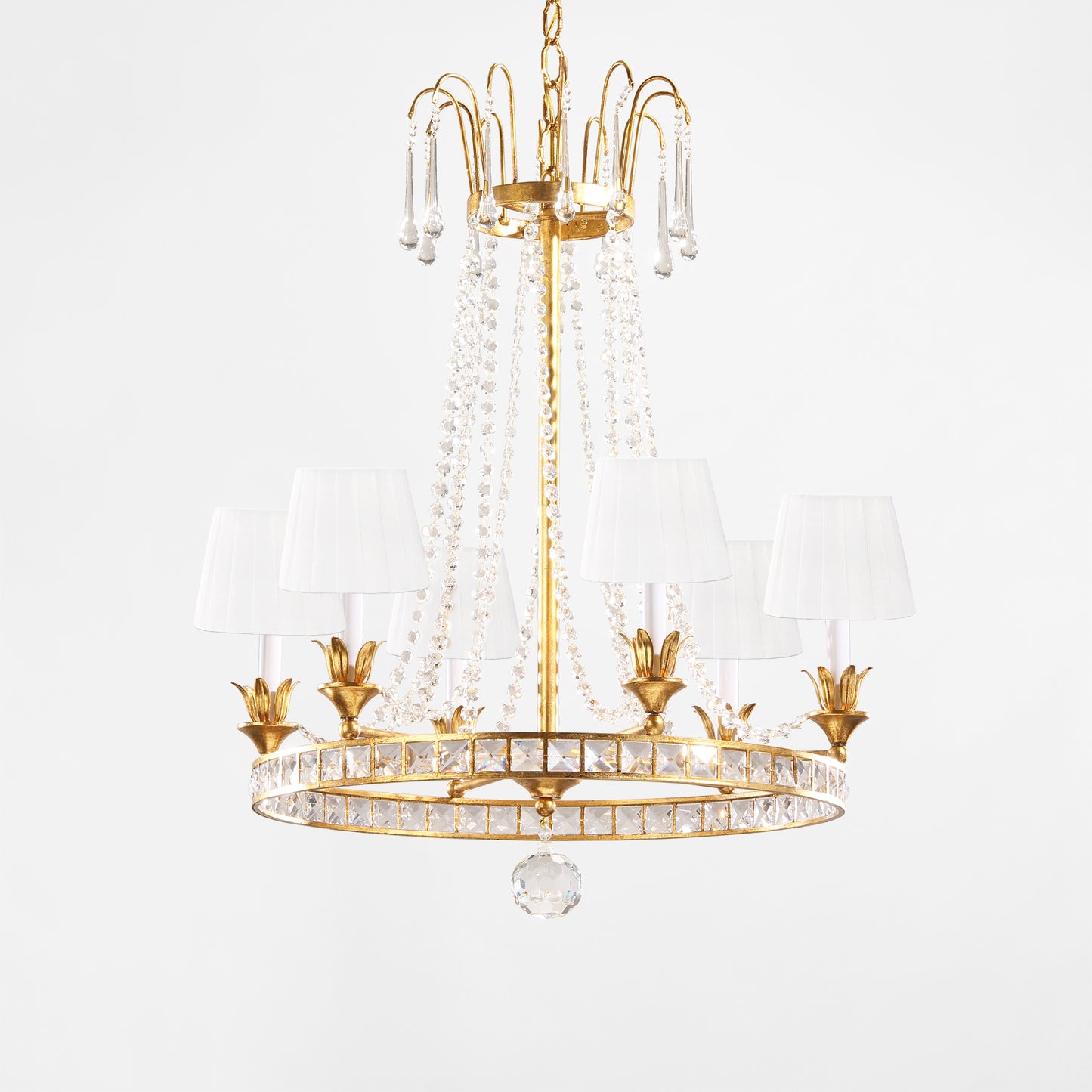 Luxurious Italian chandelier with gold details and white pleated shades.