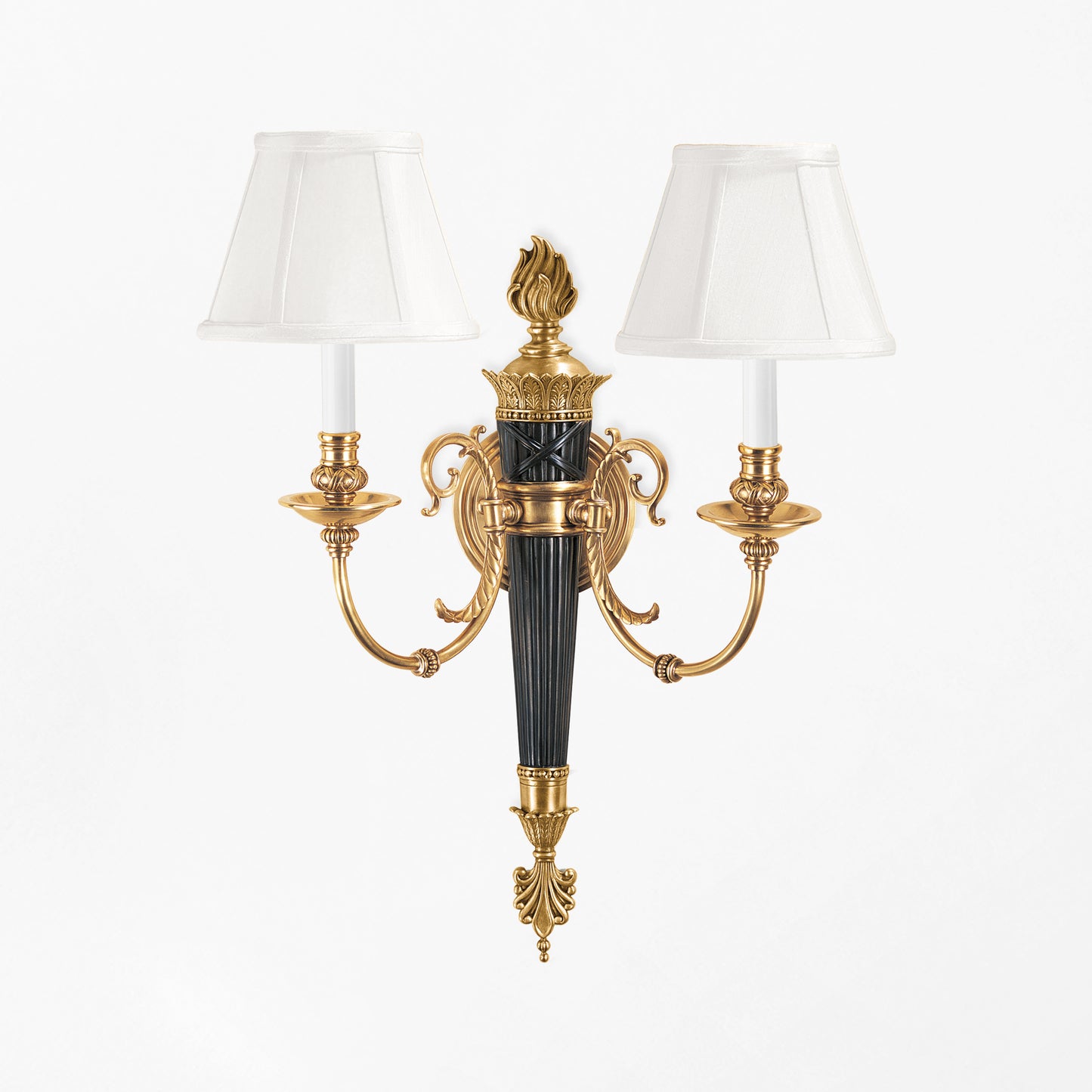 Luxurious brass sconce with black details.