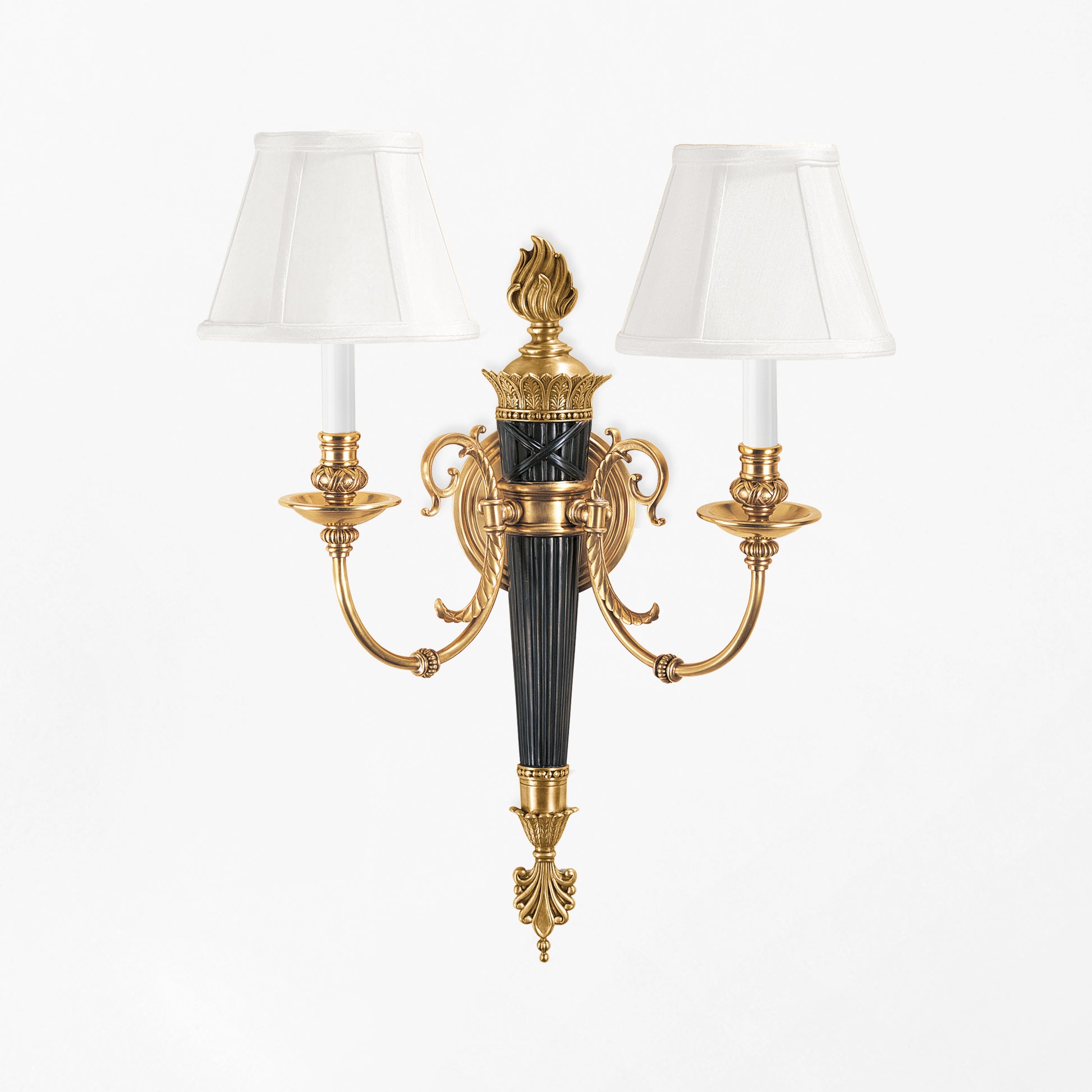 Luxurious brass sconce with black details.