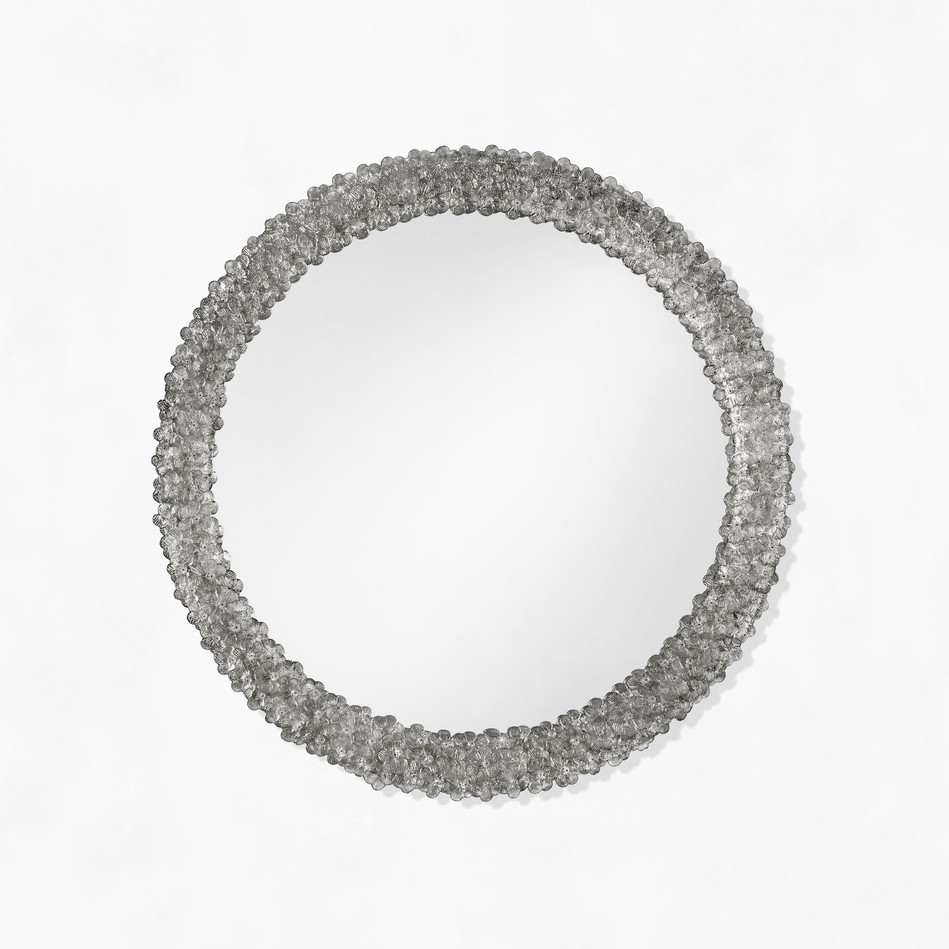 Round black Venetian glass mirror.