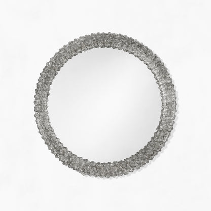 Round black Venetian glass mirror.