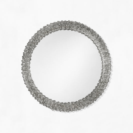 Round black Venetian glass mirror.