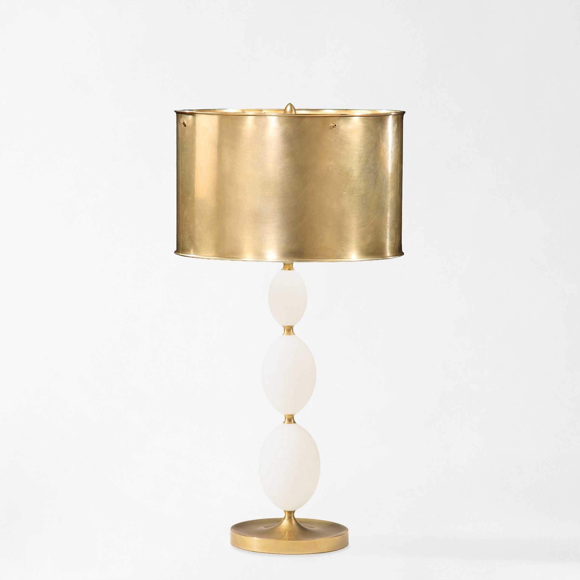 Alabaster table lamp with brass accents and brass lamp shade.