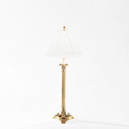 Antique brass table lamp with white lamp shade.