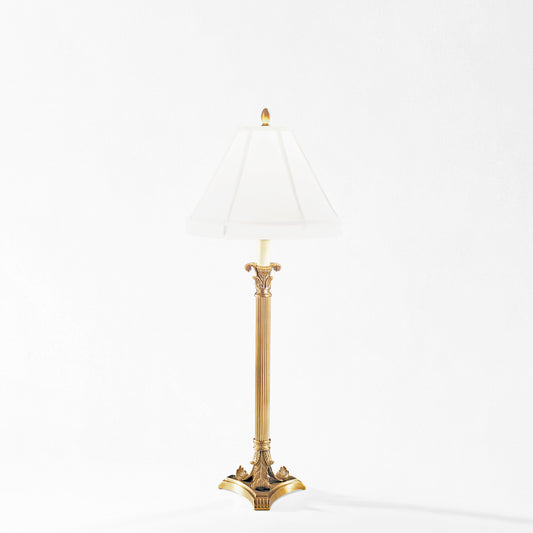 Antique brass table lamp with white lamp shade.