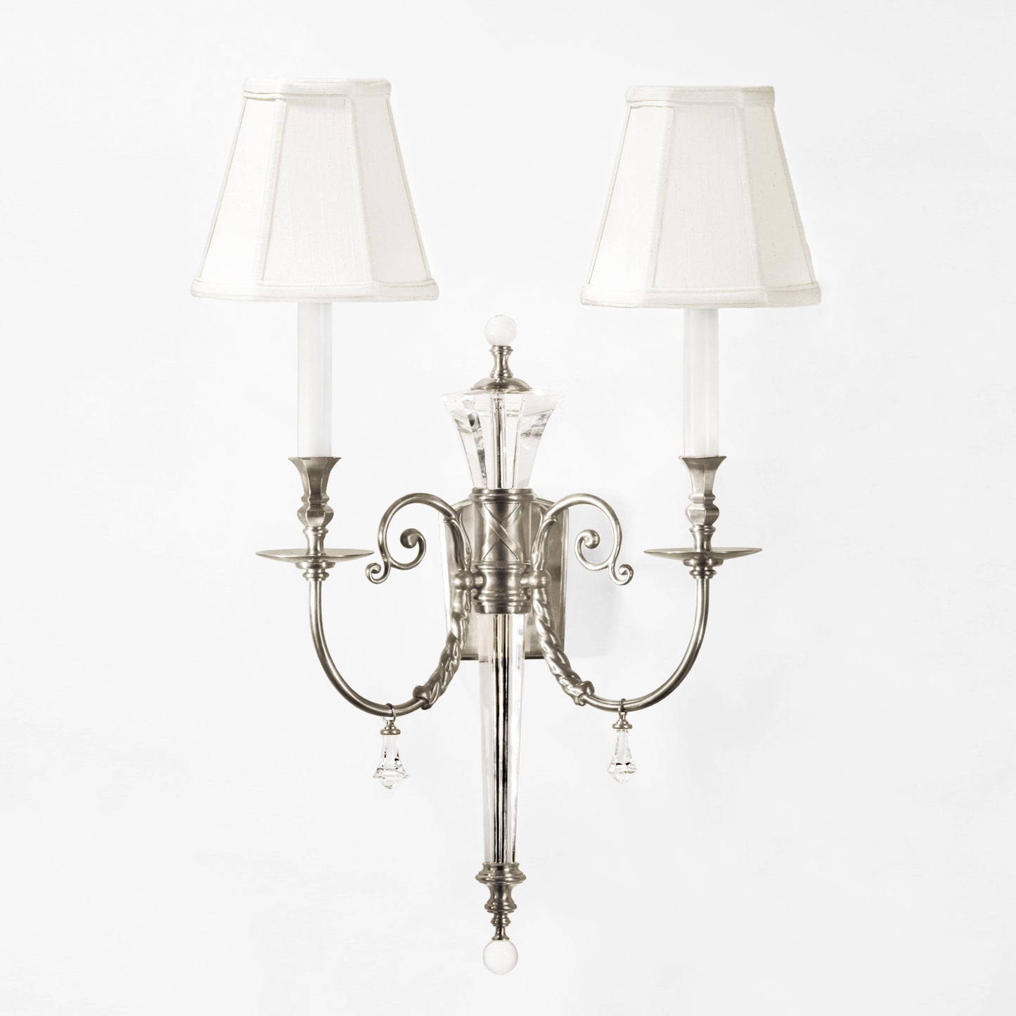 Crystal sconce with polished nickel trim and white shades.
