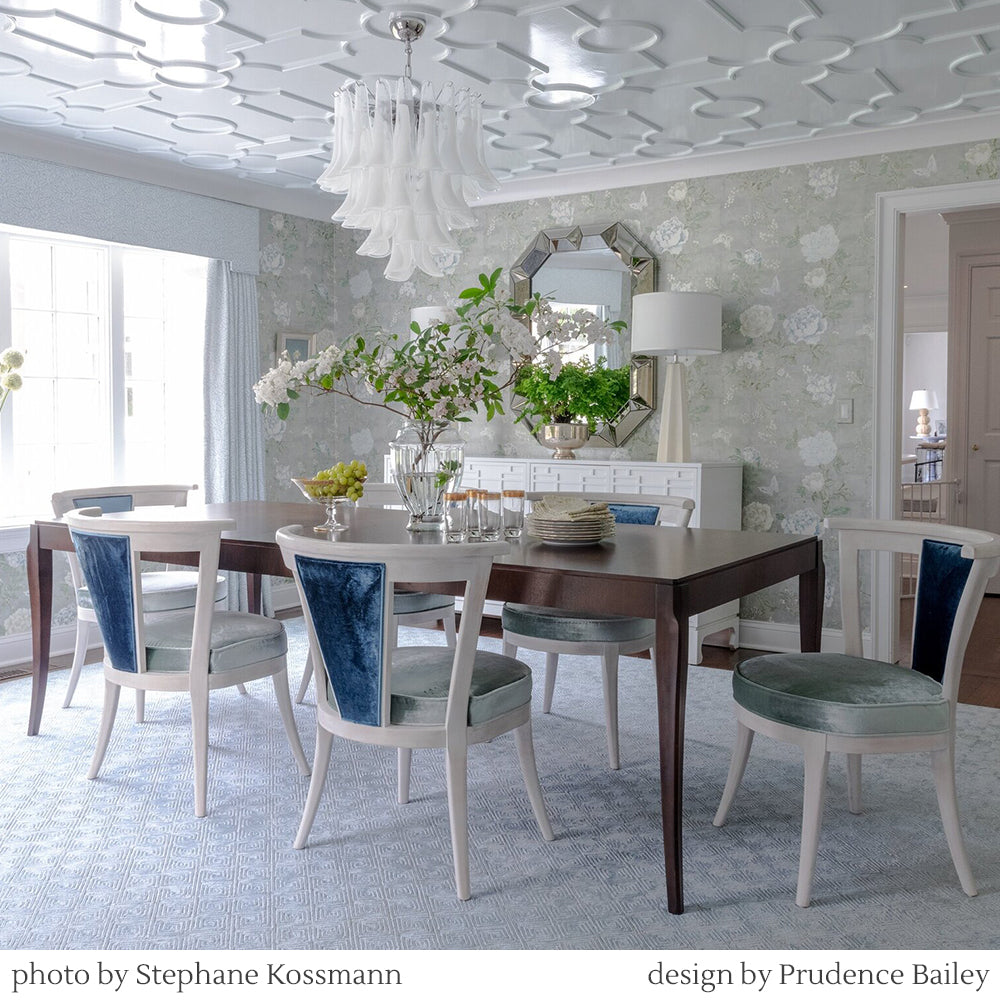 White Murano glass chandelier in luxurious dining room.