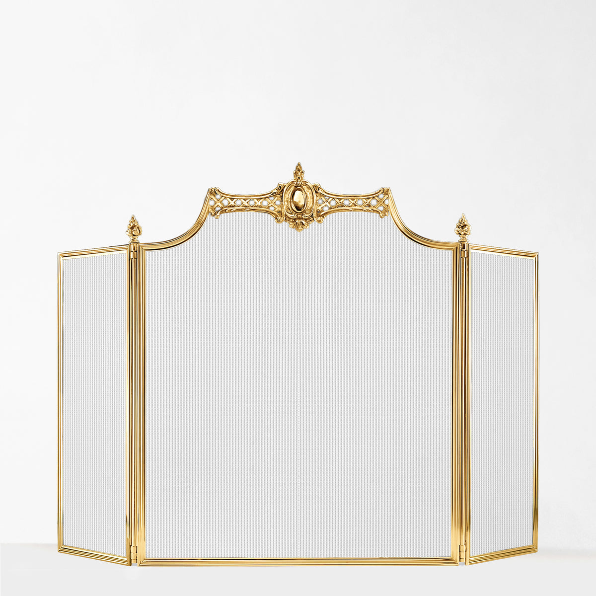 An ornate three-panel folding fireplace screen with a brass frame and ribbed mesh panels, set against a plain white background.