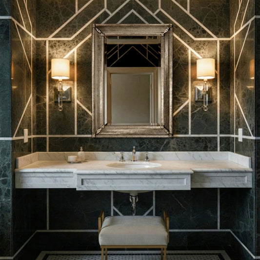 A Murano glass mirror in a black marble bathroom.
