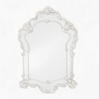 Ornate clear Murano glass mirror.