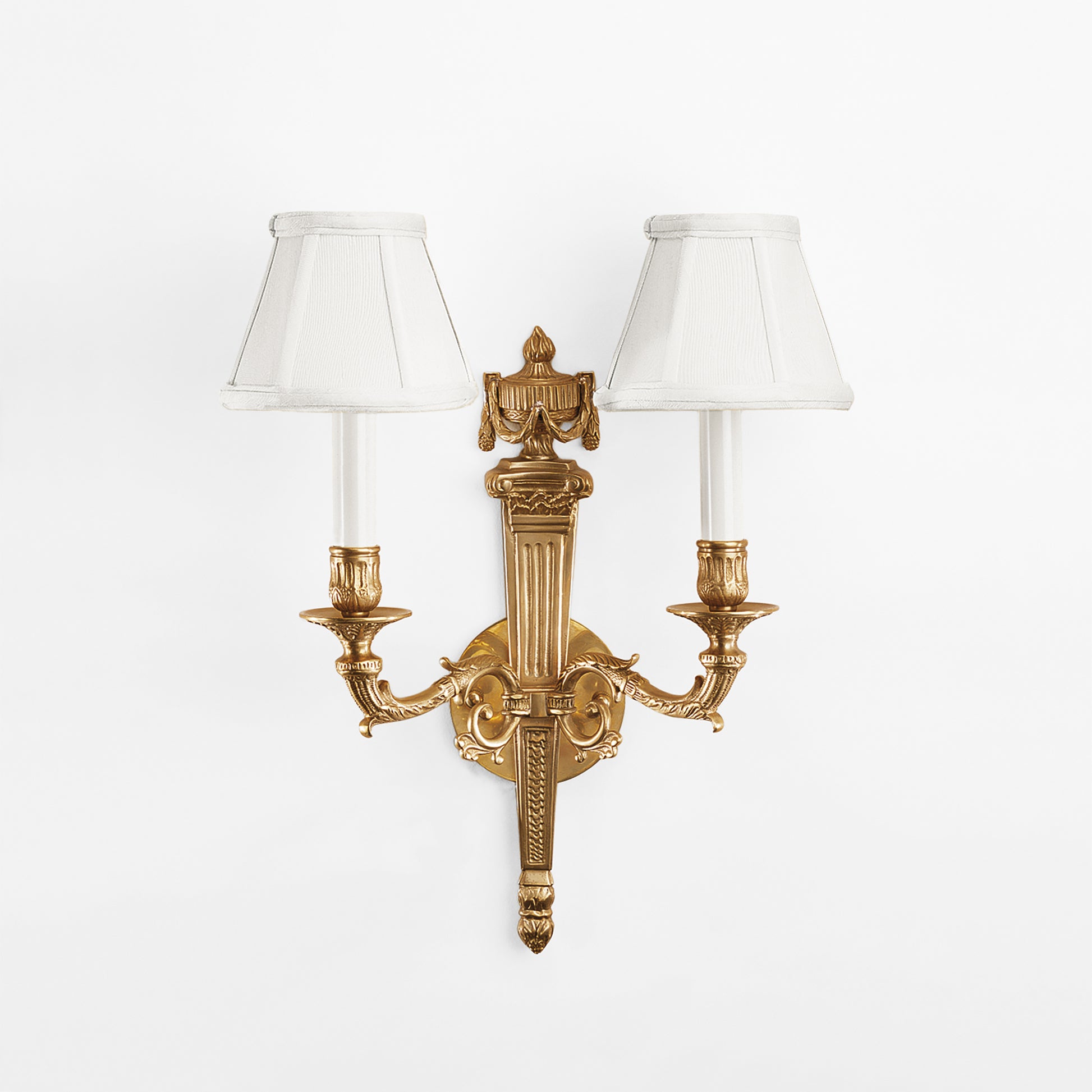 An antique brass sconce.