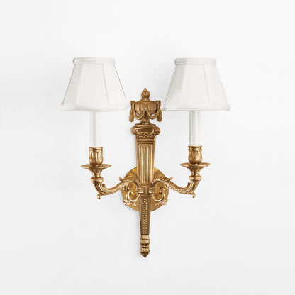 An antique brass sconce.