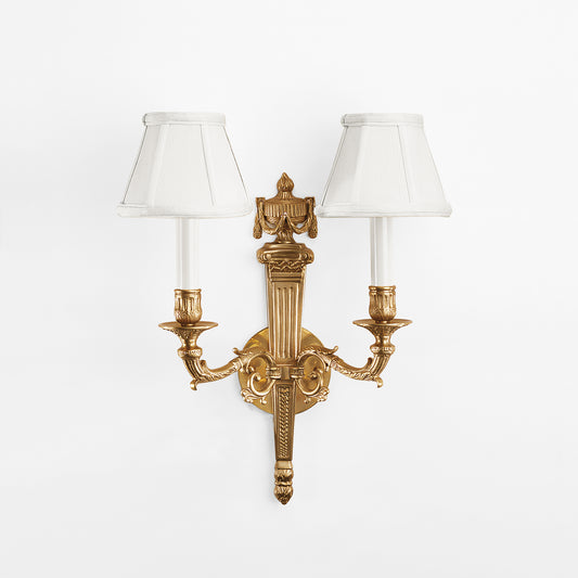 An antique brass sconce.