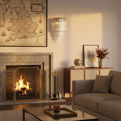 Cozy living room with a fireplace a handmade Italian glass sconce and a sofa.