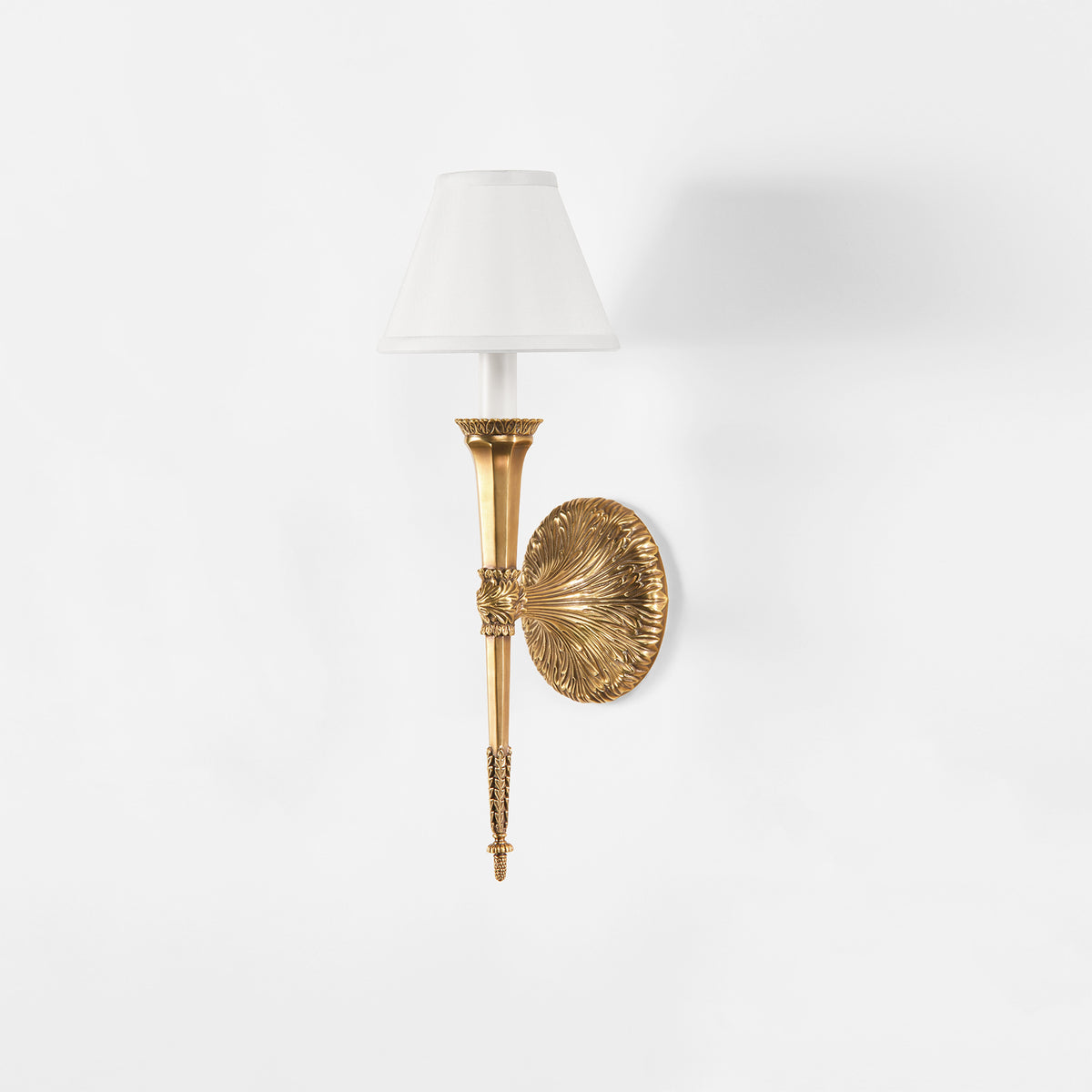 An antique brass sconce