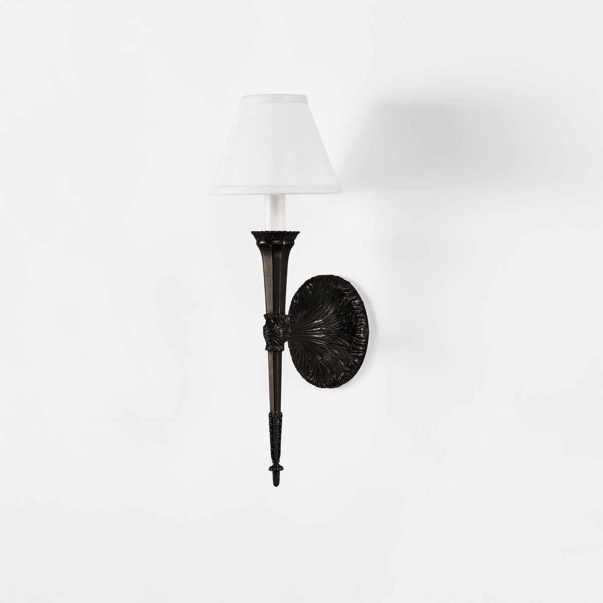 Luxurious black sconce with white shade.