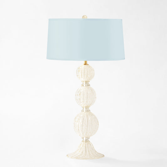 White Murano glass table lamp with light blue lamp shade.